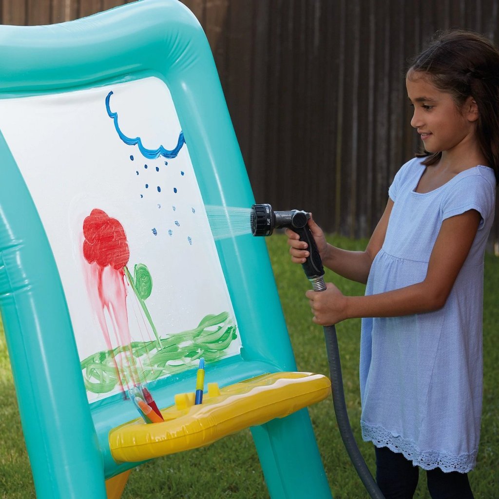 gilr hosing off paint on Inflatable Easel by Creatology