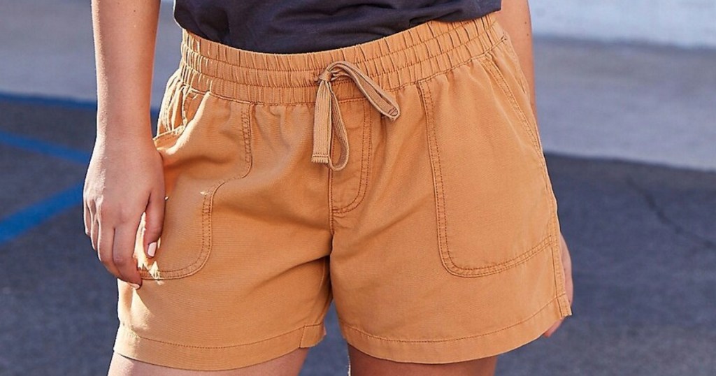 woman wearing tan shorts