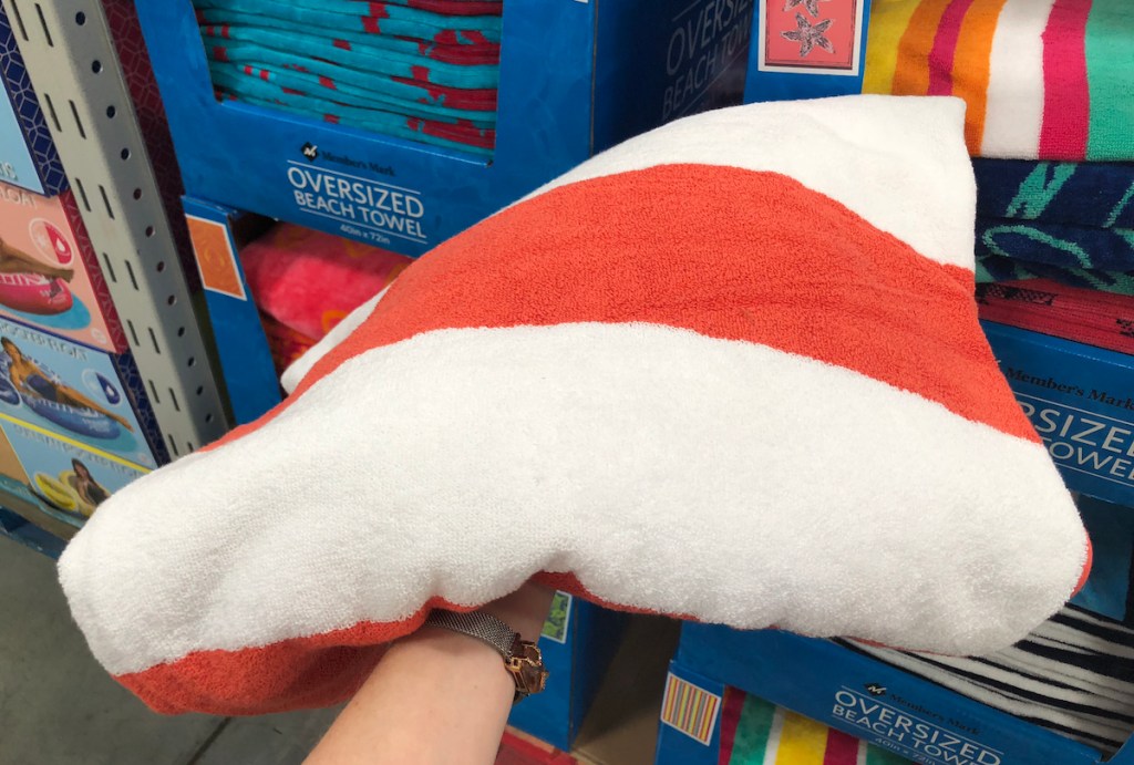 hand holding a striped towel
