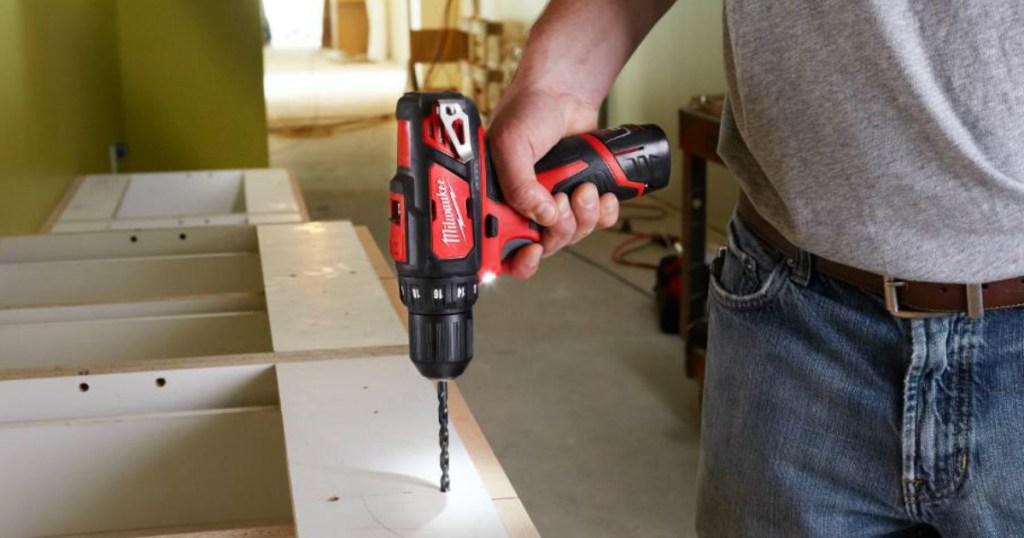 person using a drill