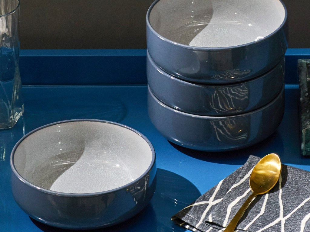 blue grey bowls stacked on a blue shelf