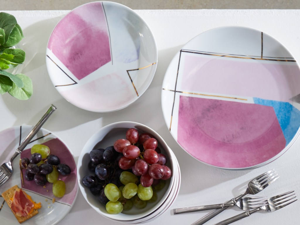 moDRN dishes and plates stacked on a table with grapes