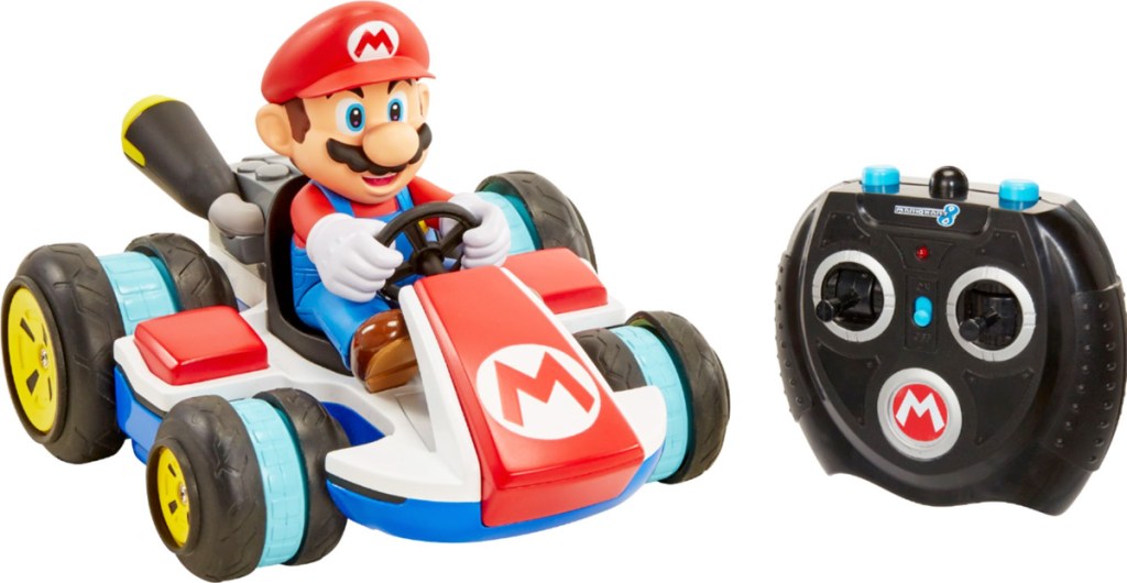 mario in mario kart with black remote control next to him