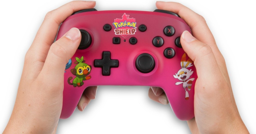 hands holding a Nintendo Switch controller