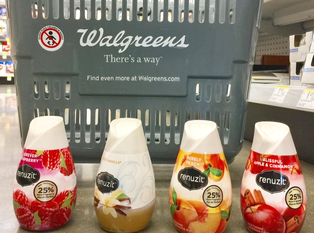 four renuzit air freshener cones on floor in front of grey walgreens shopping basket