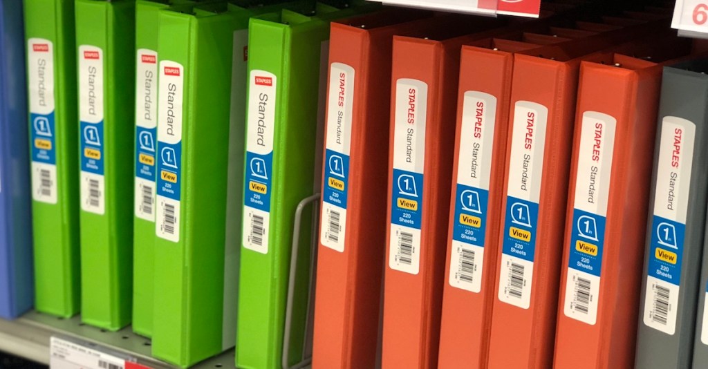 row of staples binders in green and orange