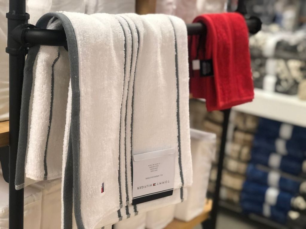 bath towel and hand towel hanging on bar at store