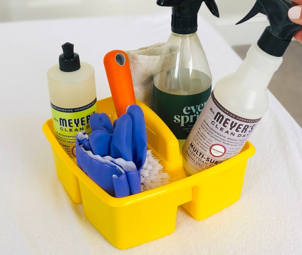 yellow caddy with cleaning supplies inside