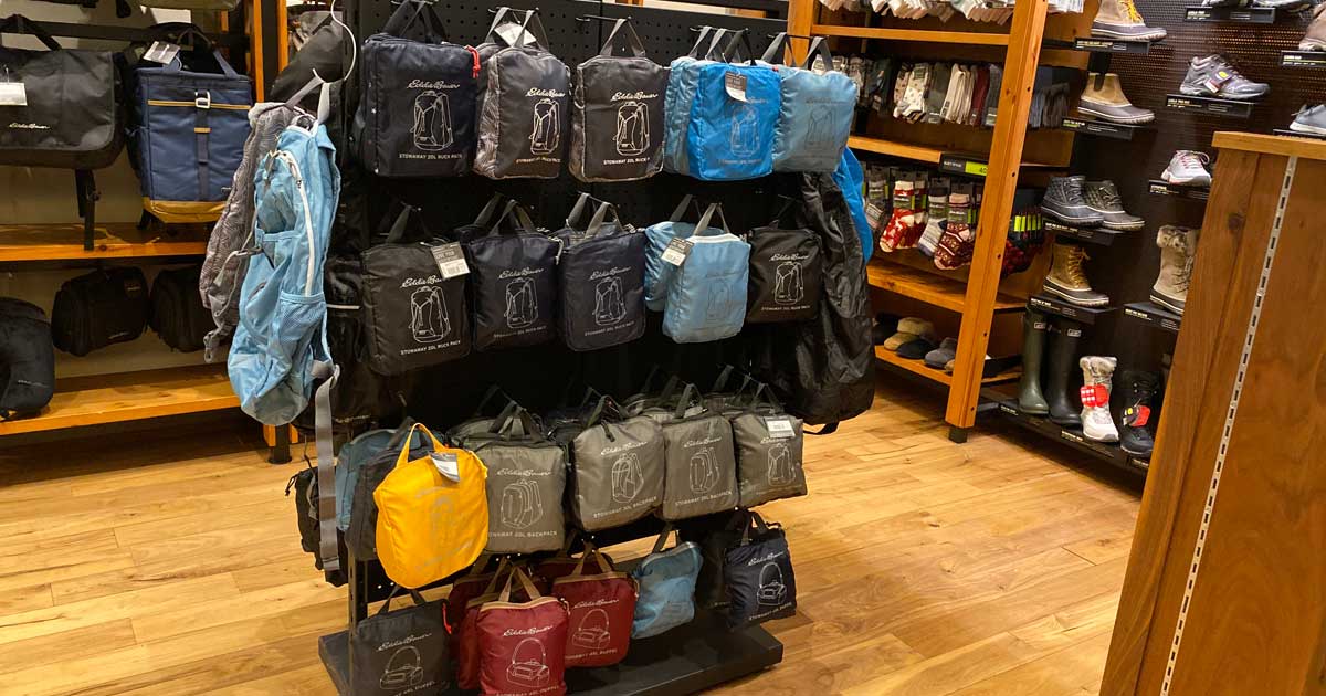 store display full of package daypacks in various colors