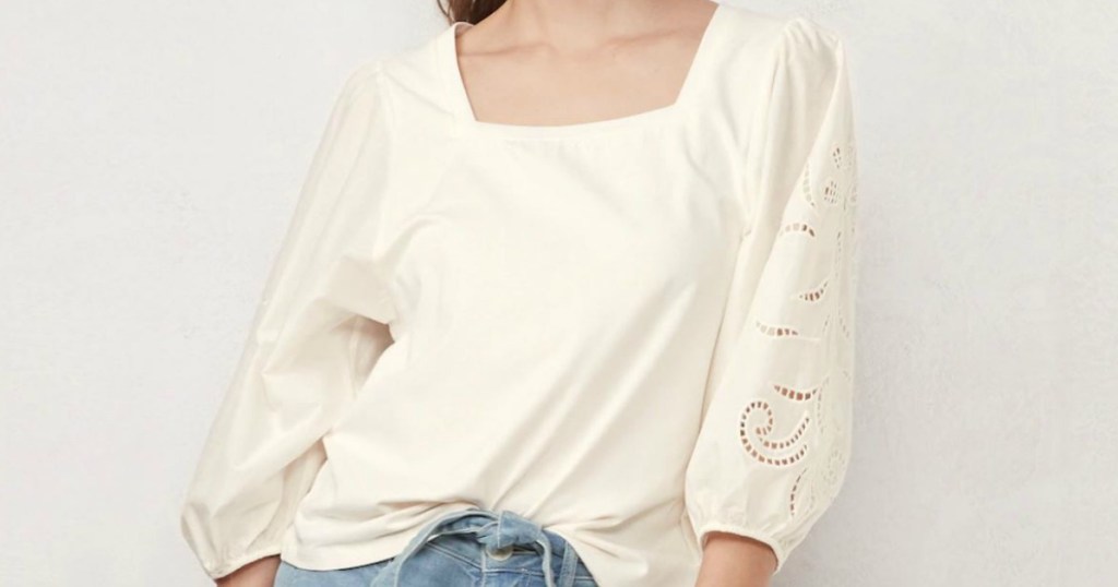 woman wearing cream colored shirt