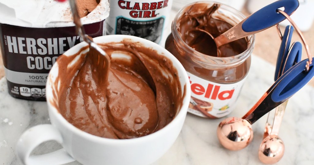 mixing a mug cake with nutella