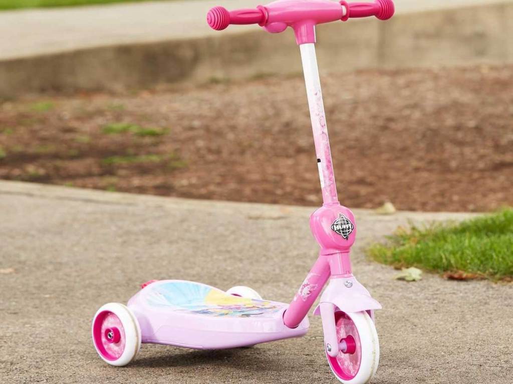 disney 3 wheel scooter on a sidewalk