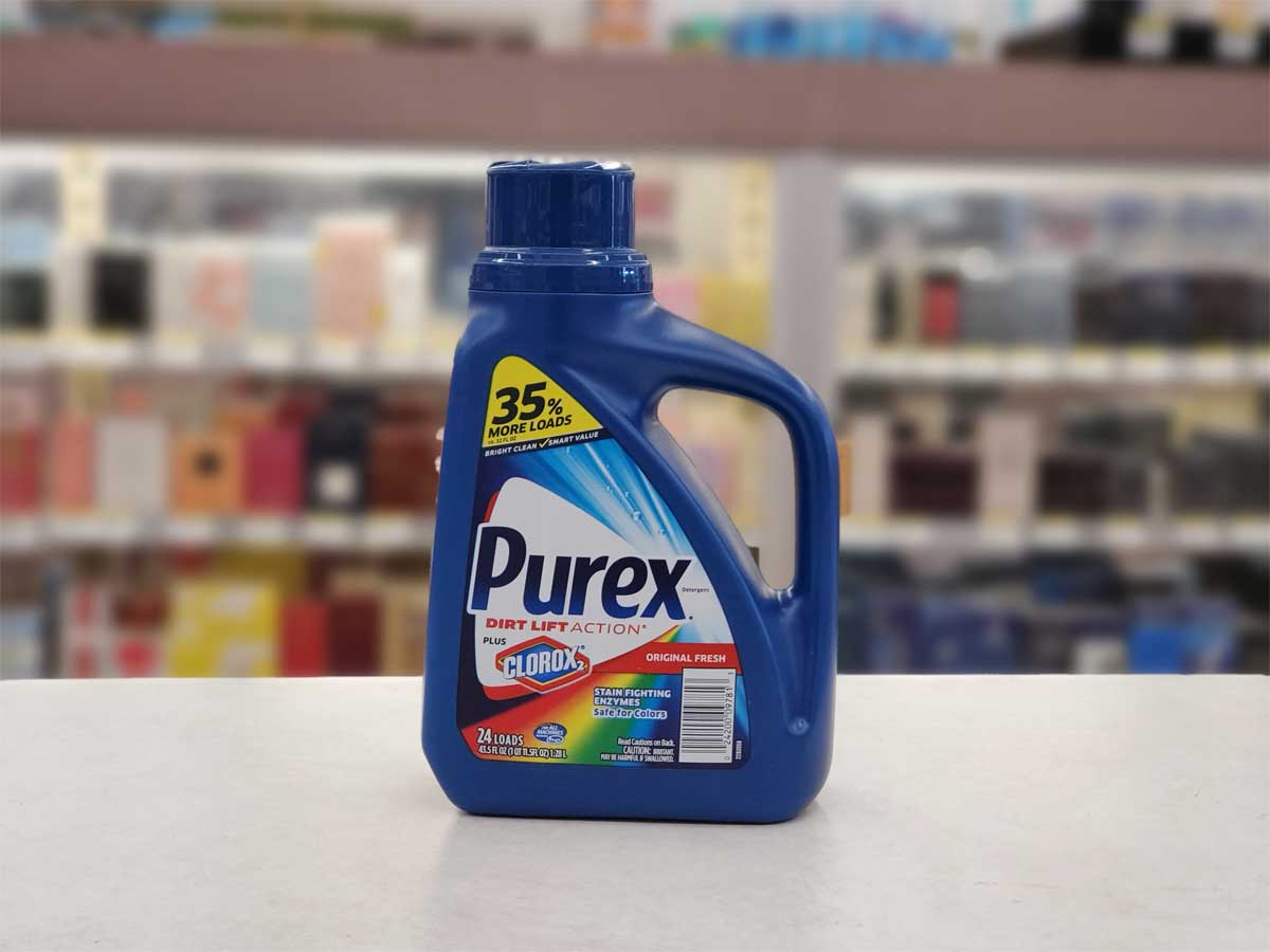 big bottle of purex laundry detergent sitting on store counter