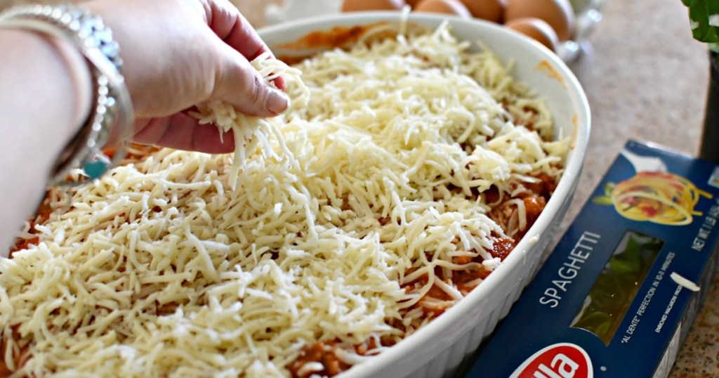 putting cheese on top of million dollar casserole