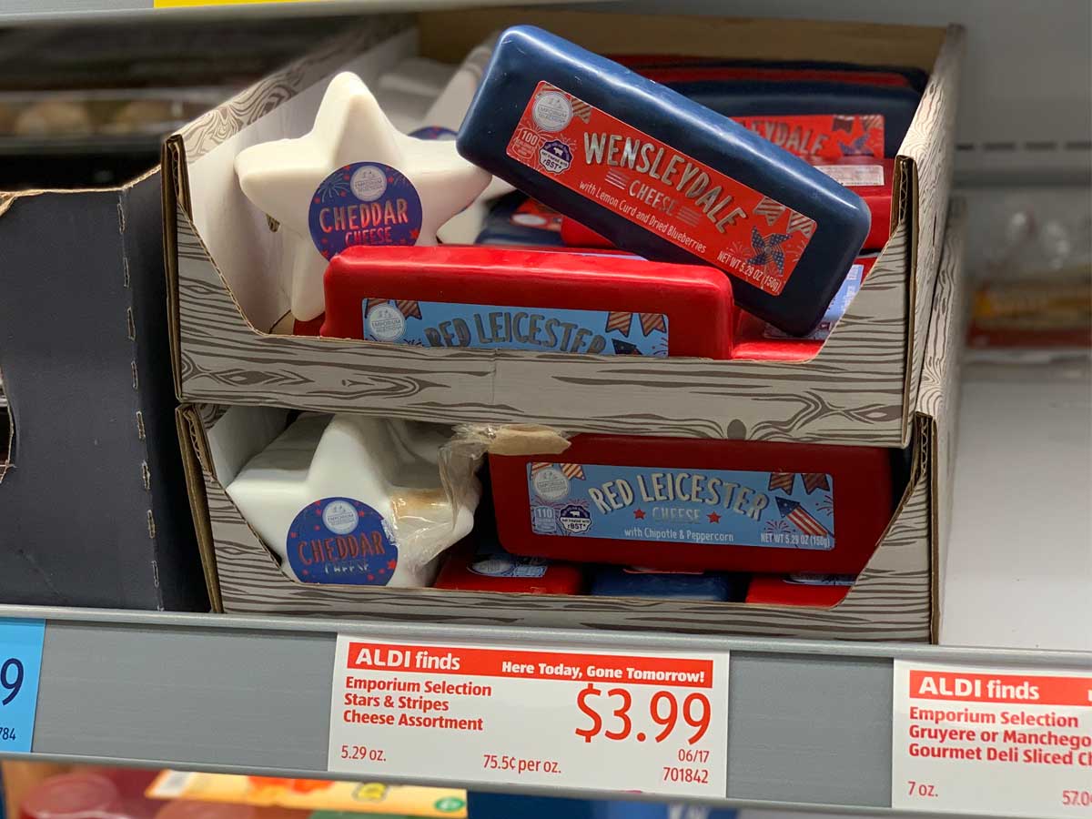 cheeses on a shelf in store shaped like star and stripes