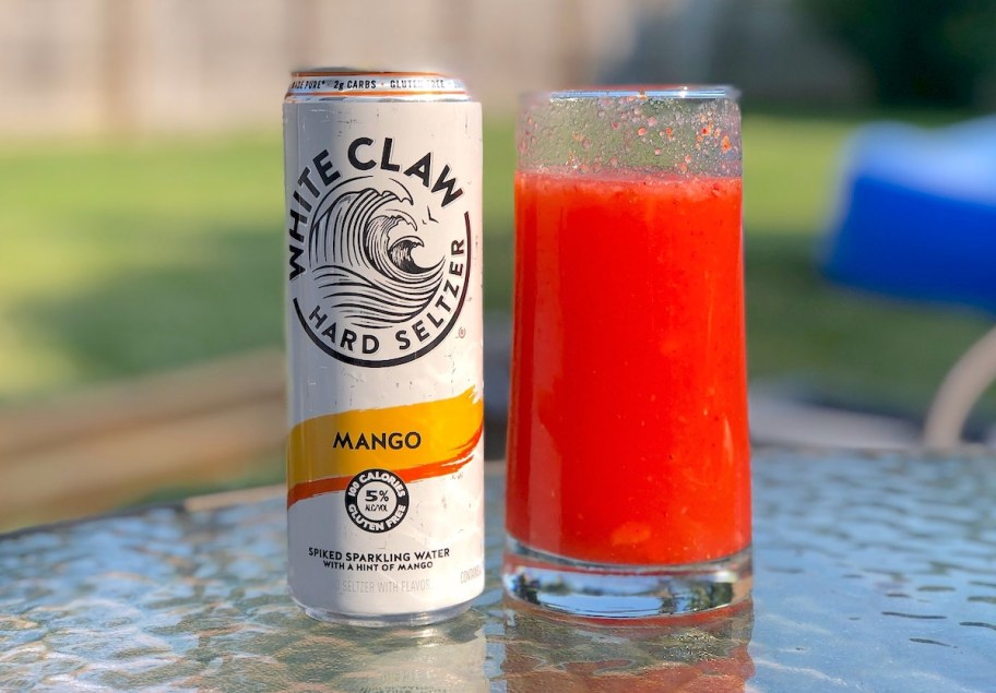 mango alcohol slushie sitting on outdoor table