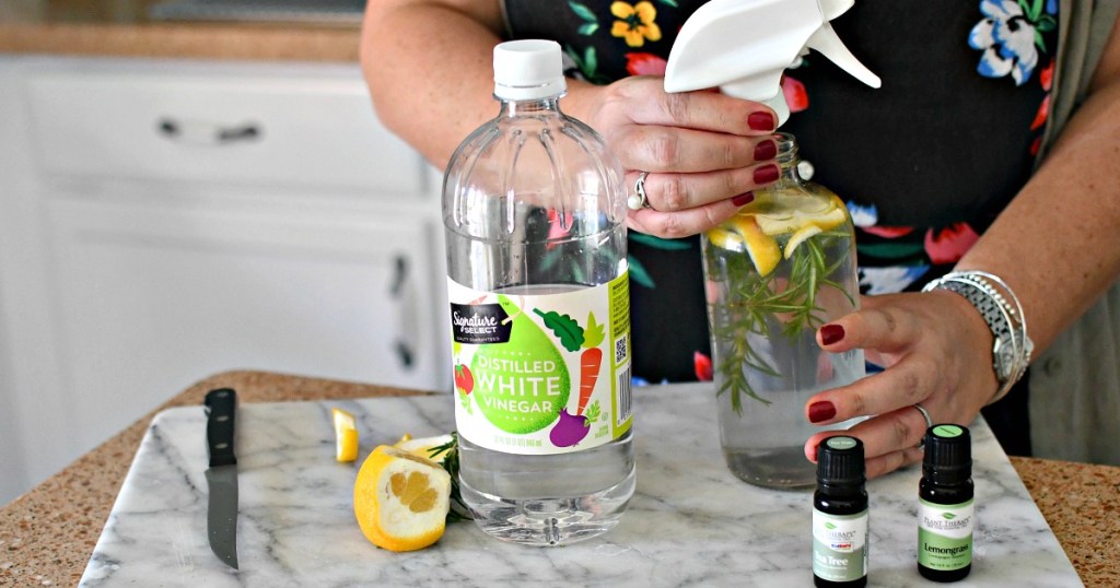 woman making vinegar cleaner