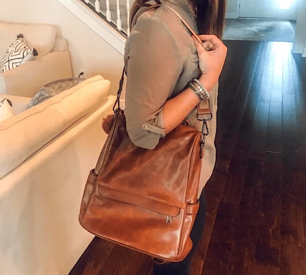 woman wearing brown leather purse 