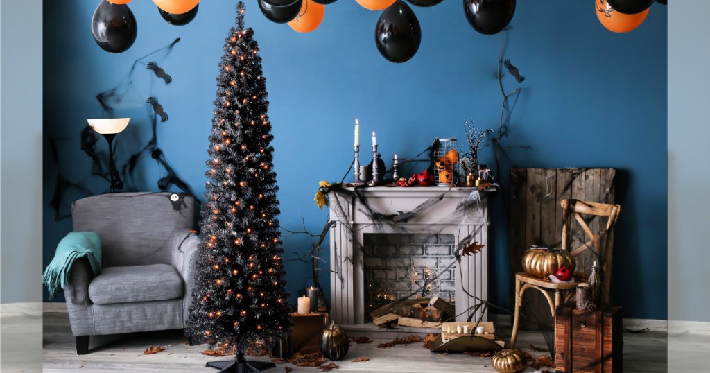 livingroom with halloween decor and 6ft. Pre-Lit Shiny Black Pencil Tree, Clear Lights by Ashland