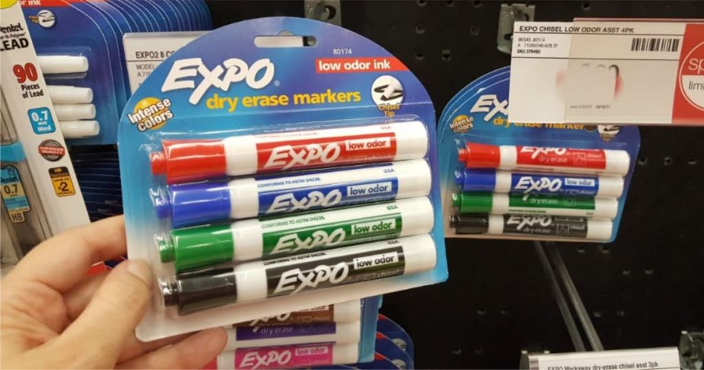 woman hand holding 4 pack of expo dry erase markers