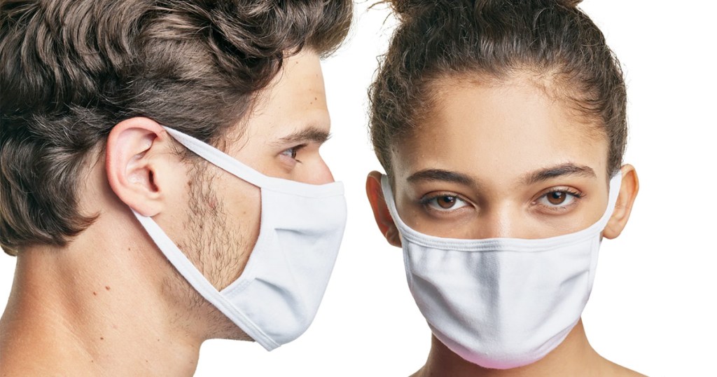 man and woman both wearing matching white face masks