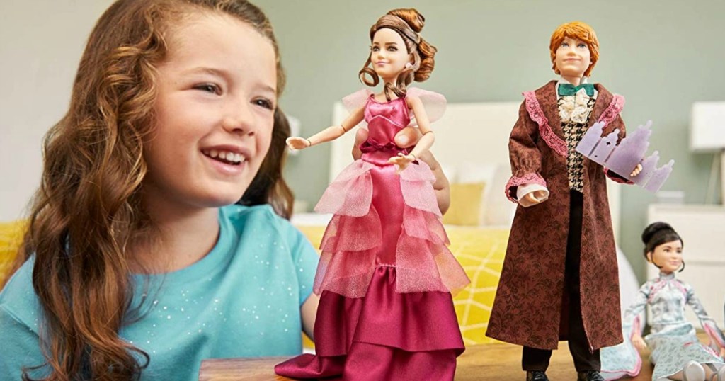 girl playing with Hermione Granger doll