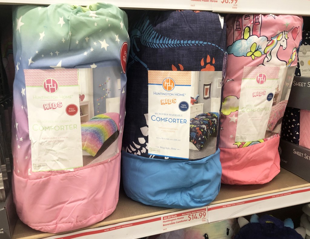 three kids reversible comforters on store display shelf