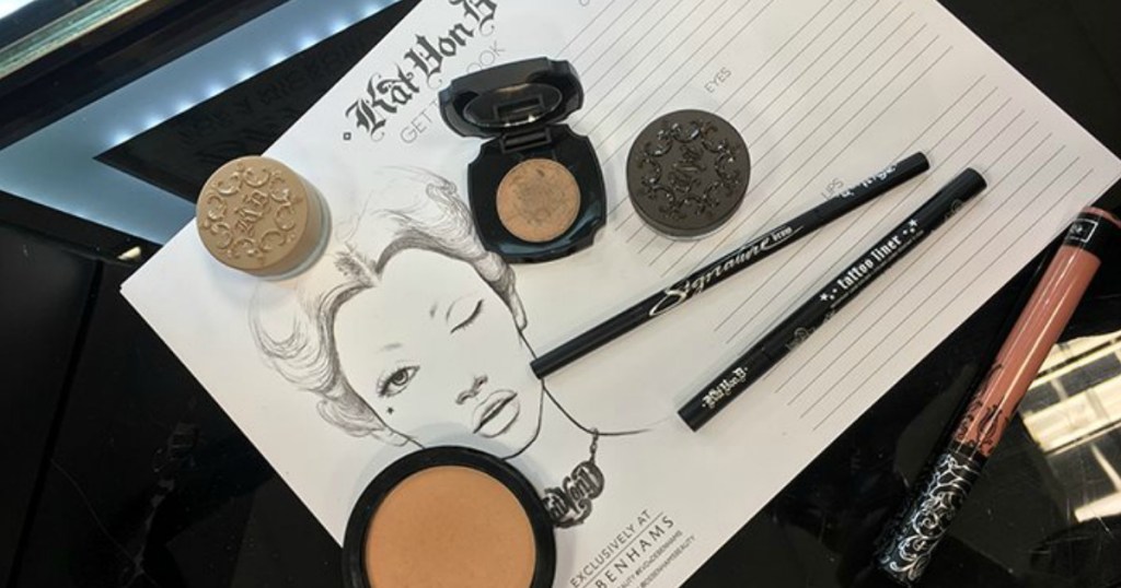 Kat Von D Cosmetics laid on table