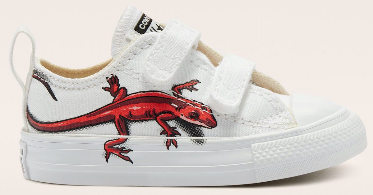 pair of kids white converse chucks with velcro and red lizard
