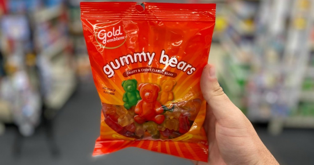 Man Holding Gold Emblem Gummy Bears