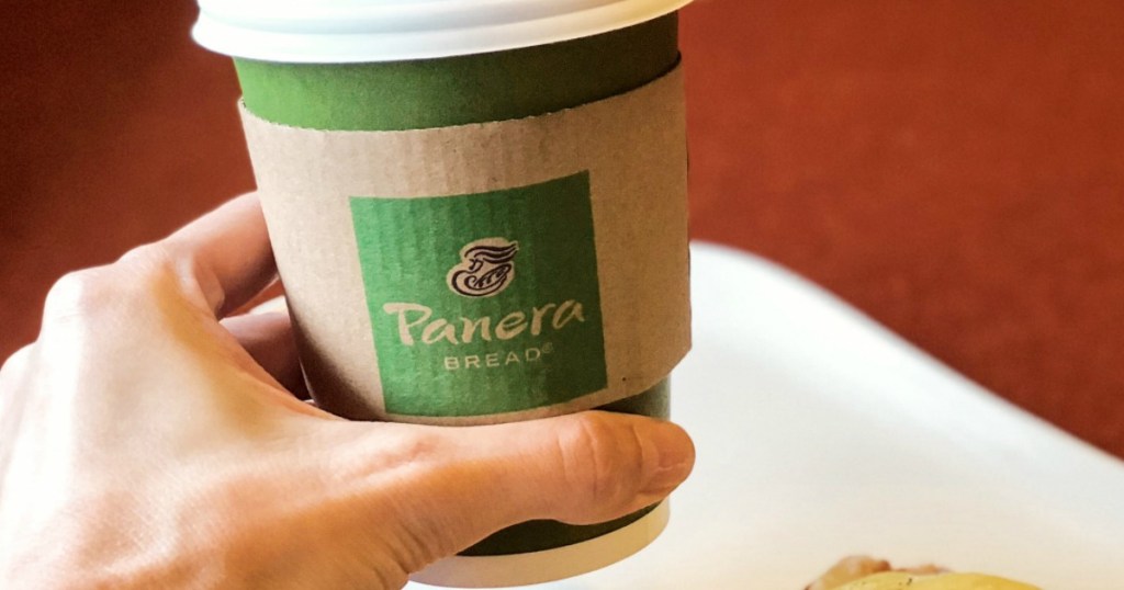 hand holding a Panera coffee cup