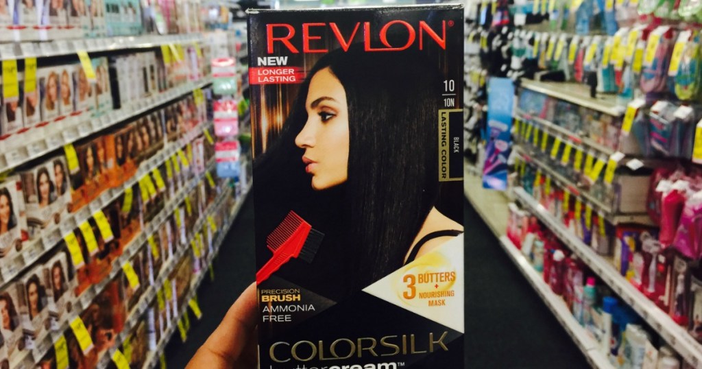 hand holding a box of Revlon hair color