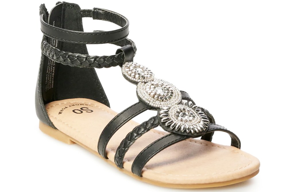 girls black gladiator sandal with three silver medallions on top