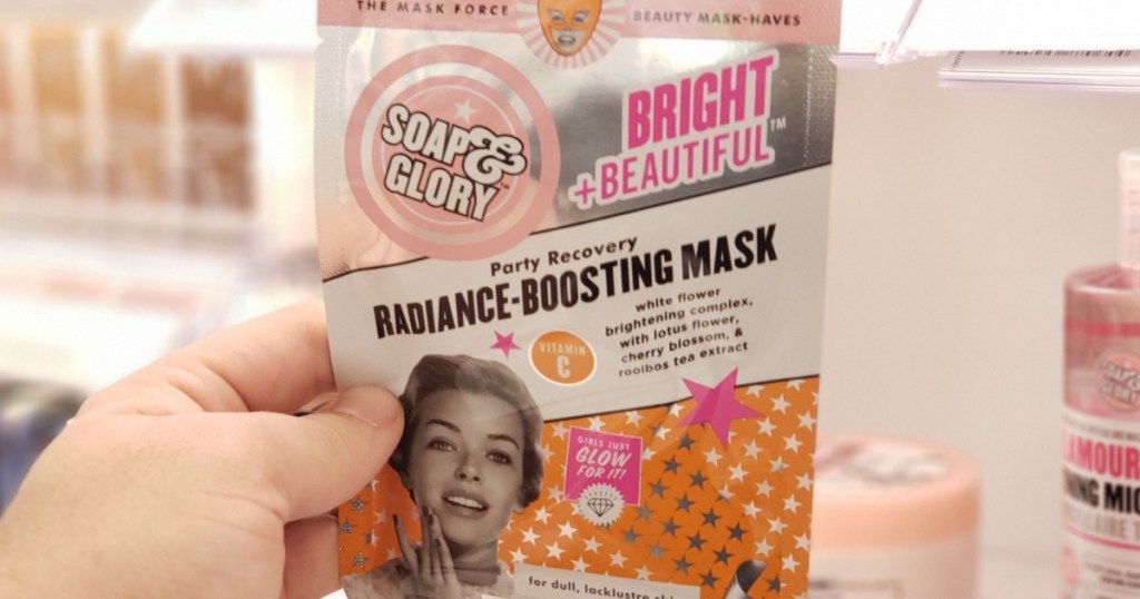 hand holding Soap & Glory Bright and Radiant Face Masks in-store