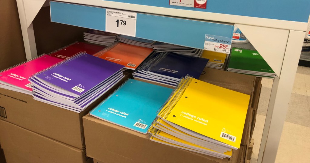 box of multiple colored staples spiral notebooks