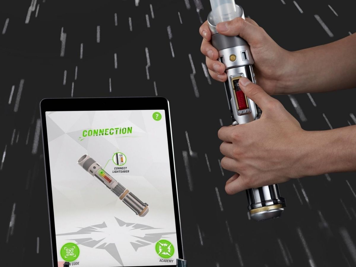 lightsaber in child's hands and ipad