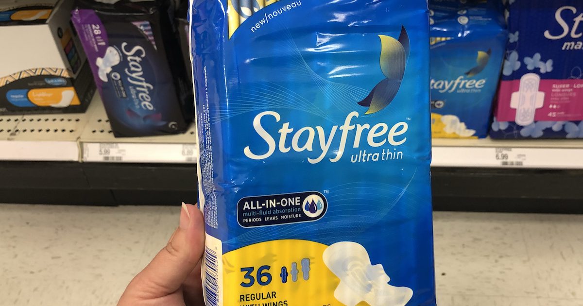 hand holding package of Stayfree pads