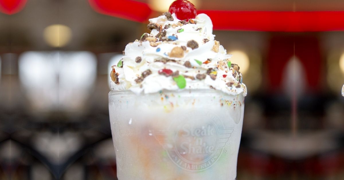 Steak n Shake Milkshake with nuts, sprinkles, and a cherry