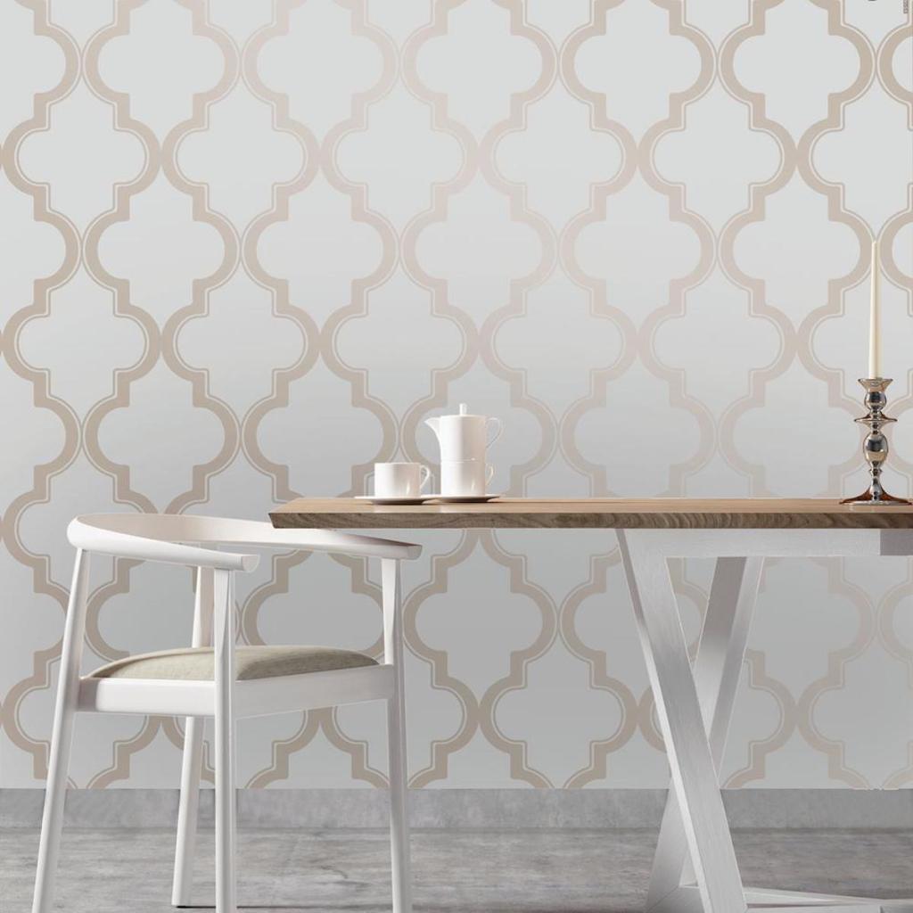 Tempaper Marrakesh WallPaper on wall with small kitchen table in front of the wall with a white chair