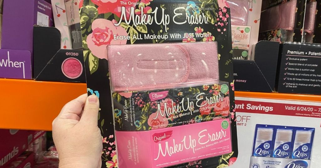 hand holding up The original makeup eraser in packaging at store