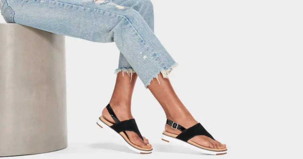 woman in jeans wearing sandals