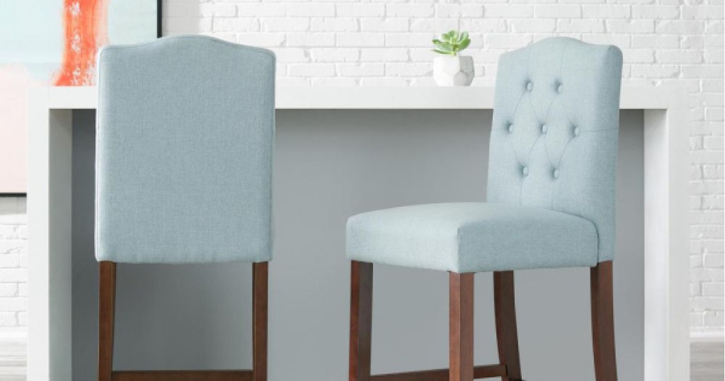 set of light blue bar stools with dark wood legs