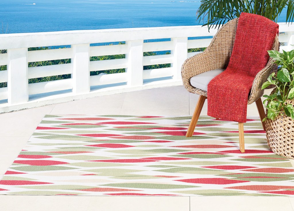 multi colored outdoor area rug on patio overlooking beach