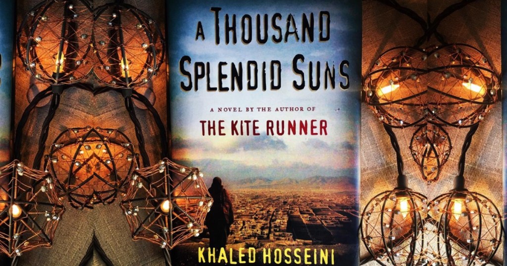 A thousand splendid suns book with lights surrounding it