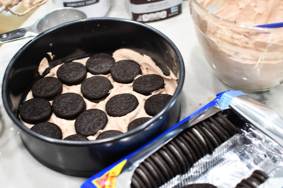 adding oreos to a springform pan