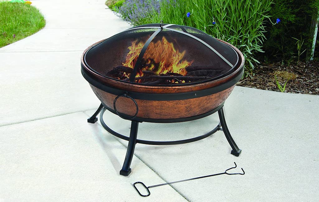 copper fire bowl outside on patio