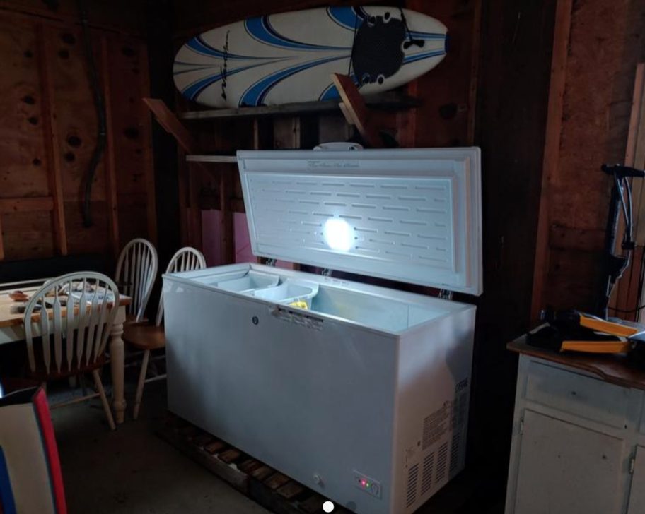 upright freezer with door open