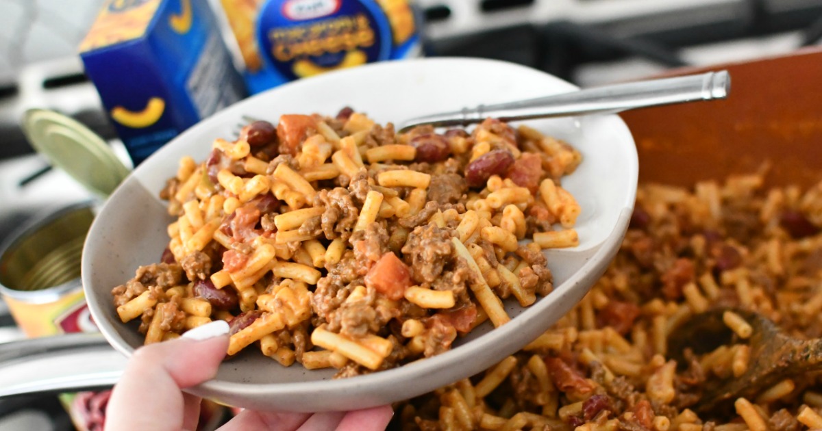 holding mac and cheese with taco meat - budget-friendly meals