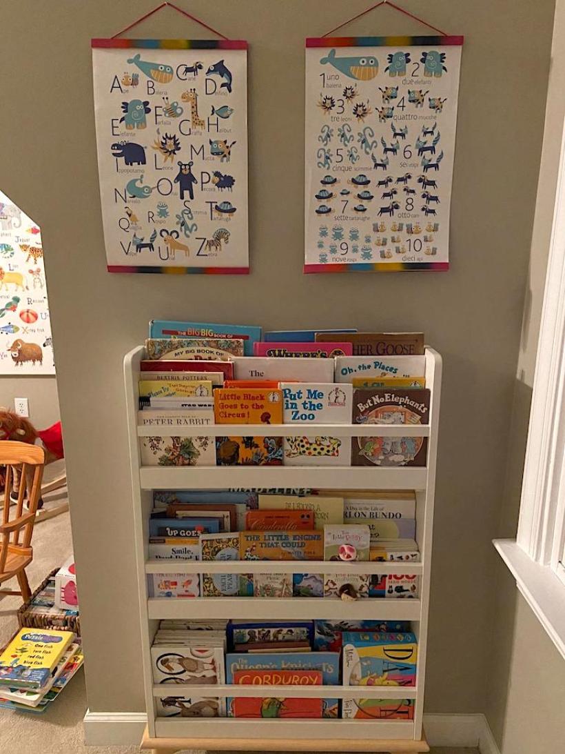 pictures handing above bookcase in kids playroom 