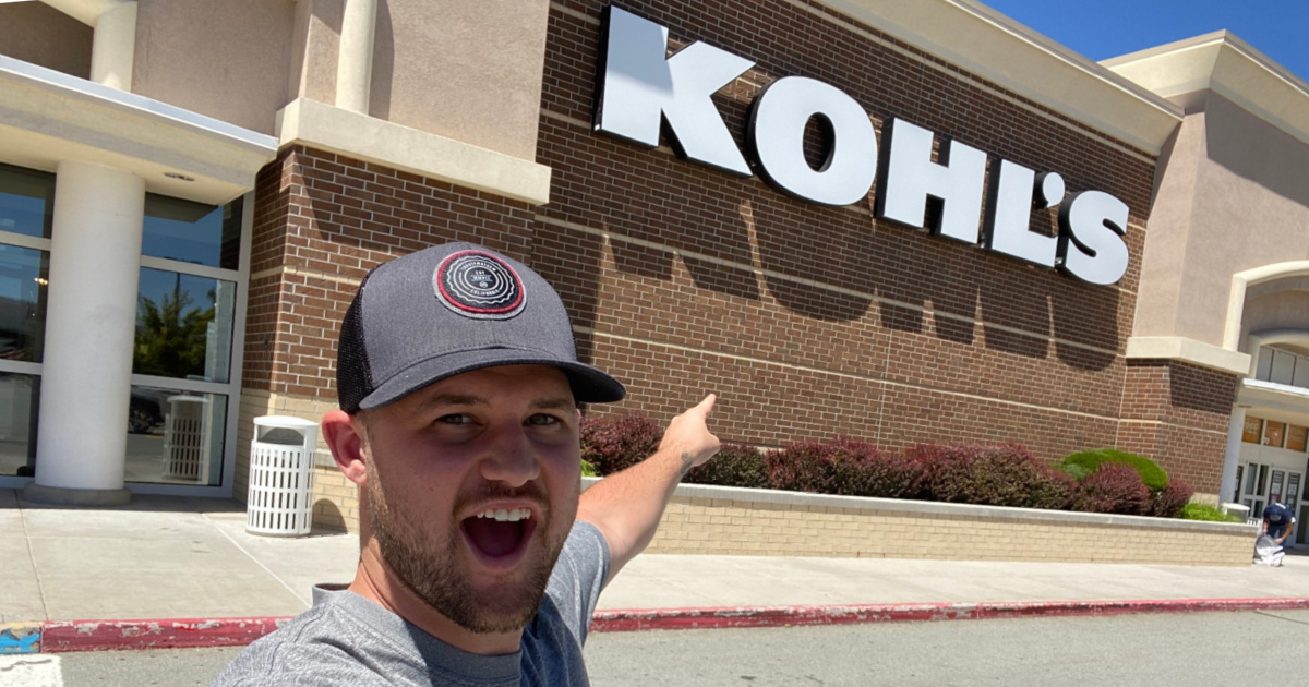 man pointing at Kohl's store 